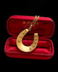 VICTORIAN 15CT GOLD HORSESHOE PENDANT ‘SLOW RACE’
