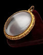 VICTORIAN ORNATE GOLD FRAMED GLASS LOCKET