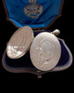 LARGE SCALE VICTORIAN SILVER ‘GARTER MOTIF’ LOCKET
