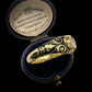 19TH CENTURY DIAMOND RING WITH BLACK ENAMEL SCROLL BAND