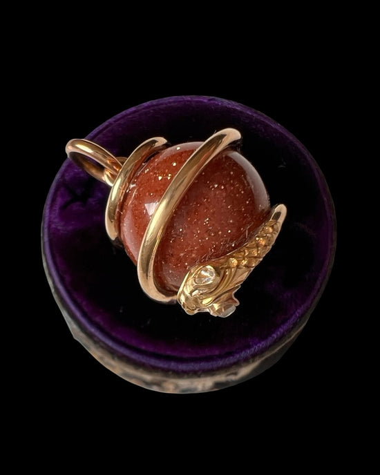 VICTORIAN 15CT GOLD COILED SNAKE & GOLDSTONE SPHERE PENDANT