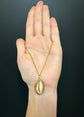 19TH CENTURY COWRIE SHELL PENDANT