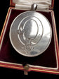 LARGE SCALE VICTORIAN SILVER ‘GARTER MOTIF’ LOCKET