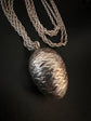 19TH CENTURY SILVER EGG PENDANT