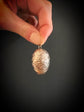 19TH CENTURY SILVER EGG PENDANT